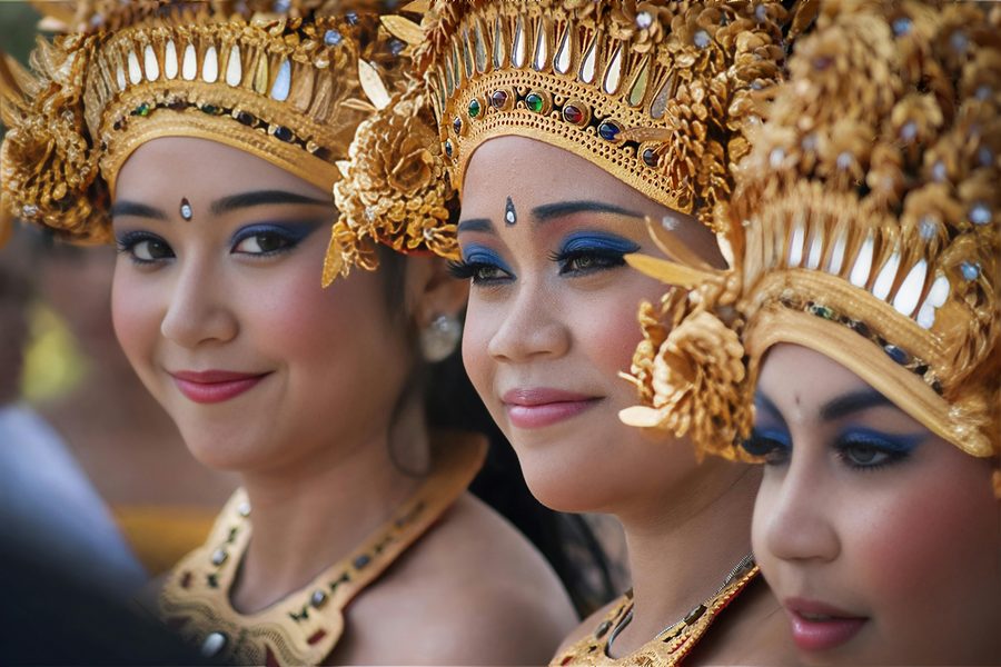 Balinese temple dancers in gold traditional headdresses