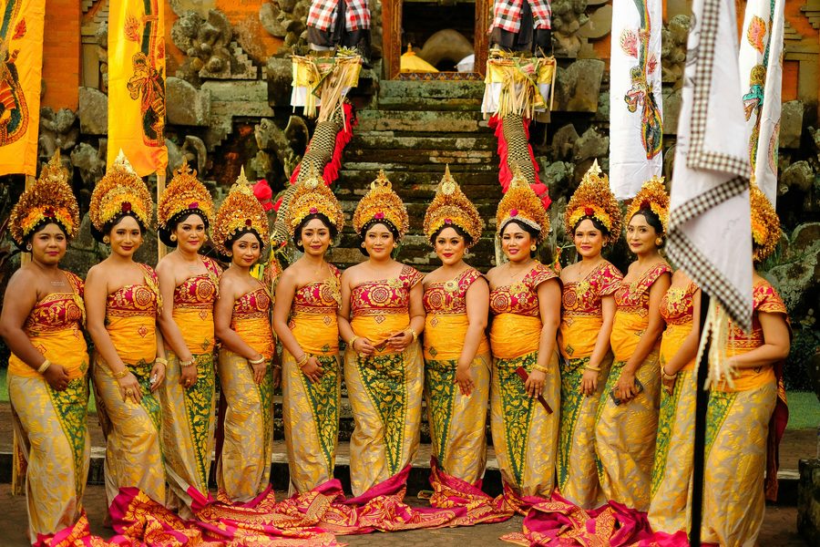 Balinese ceremony dancers lined up at a temple in Bali