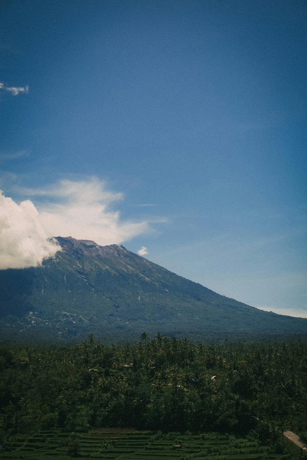 Mount Agung volcano rising over Bali jungle