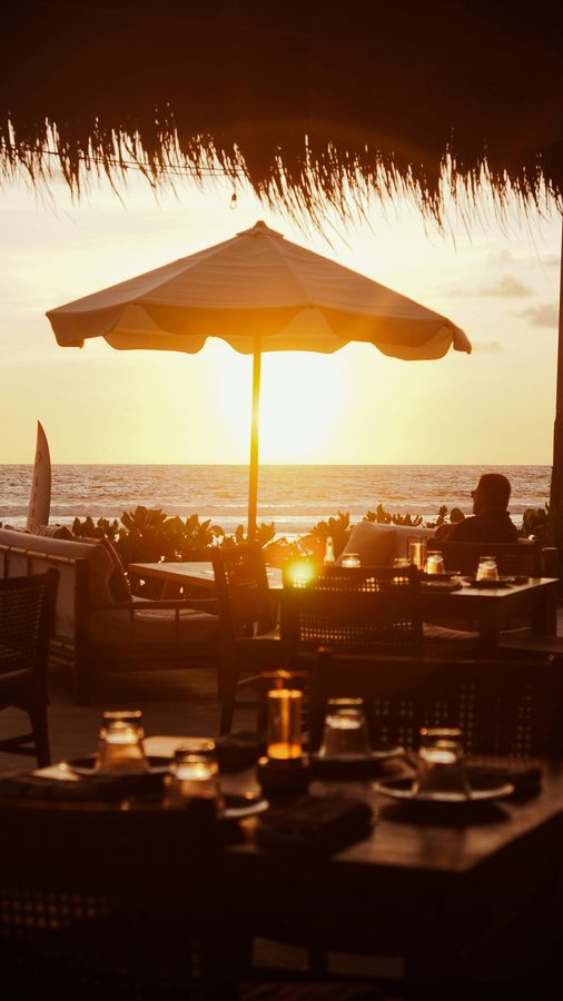 Beachfront sunset dining at a Bali beach restaurant
