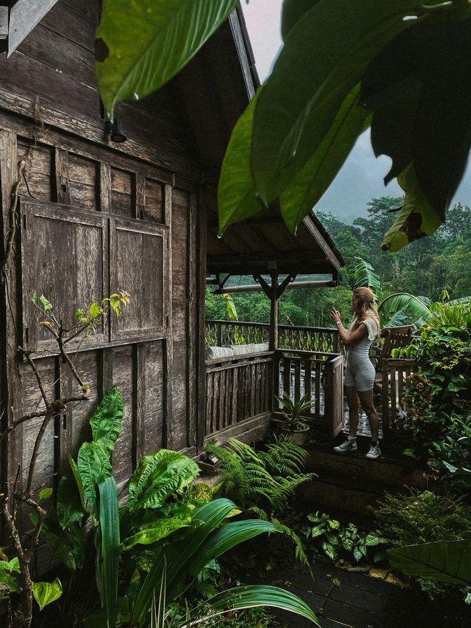 Wooden jungle villa terrace overlooking Bali rainforest