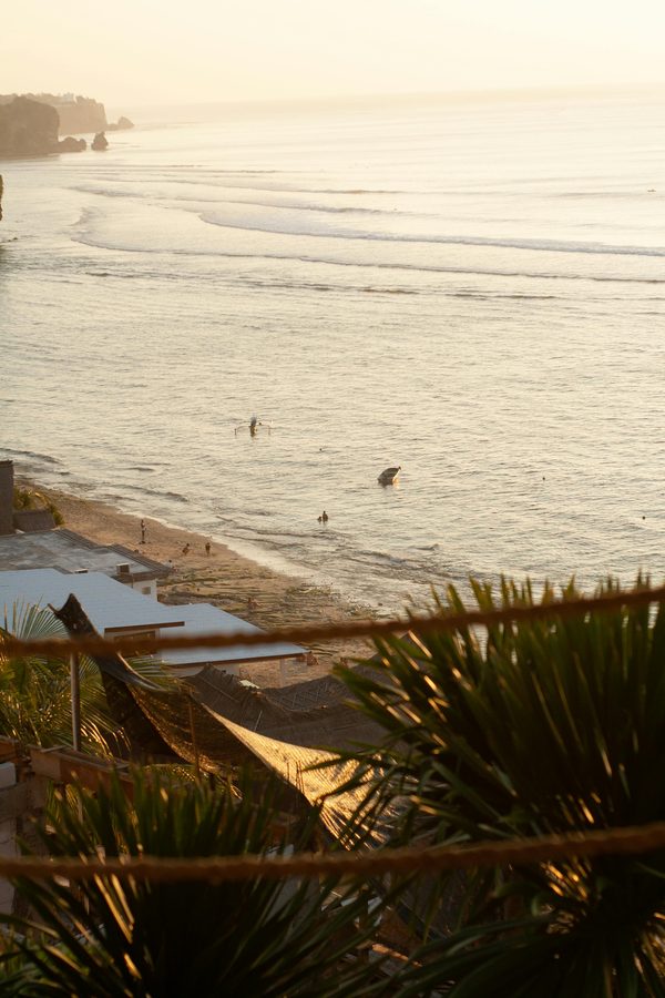 Afternoon surf seen from a Bali cliff-top warung